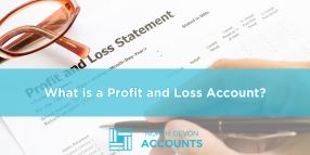 Profit and loss statement on a desk with glasses, illustrating what a profit and loss account is with guidance from North Devon Accounts