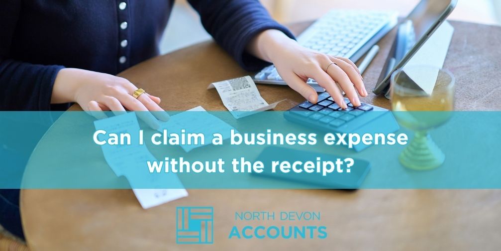 Business owner reviewing receipts and calculating expenses for their accounts with North Devon Accounts.
