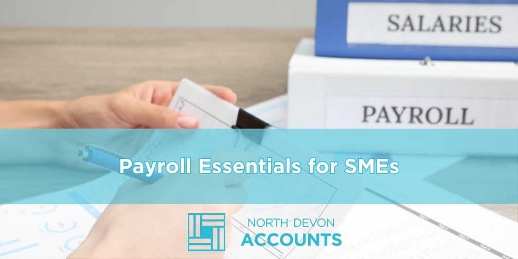 Person organising payroll documents with folders labelled salaries and payroll, illustrating payroll essentials for SMEs with guidance from North Devon Accounts